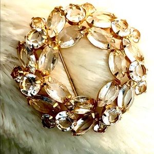 Vintage gold brooch embellished with crystals